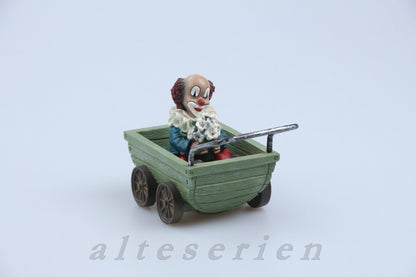 Figur im Wagen